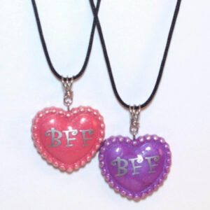 Pink and purple clay hearts with silver BFF vinyl letters on a black nylon cord.