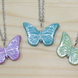 Polymer clay butterfly with silver accent on stainless steel chain.