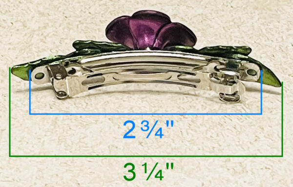 Purple chrome color flower barrette with green leaves back side.